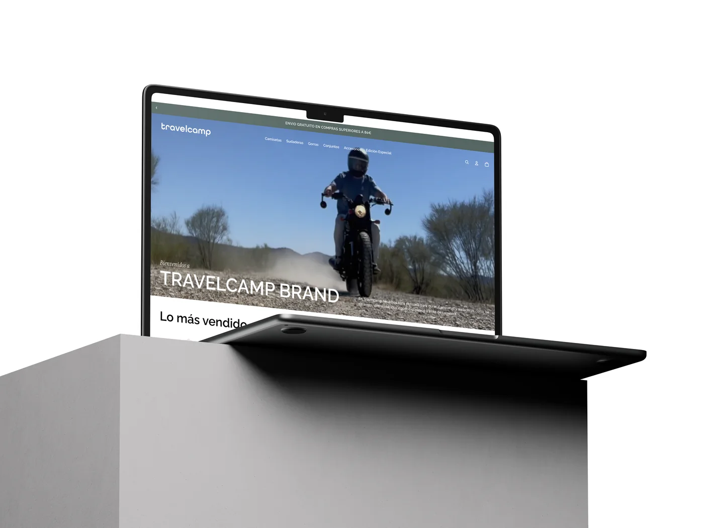 TravelCamp e-commerce website shown on a laptop